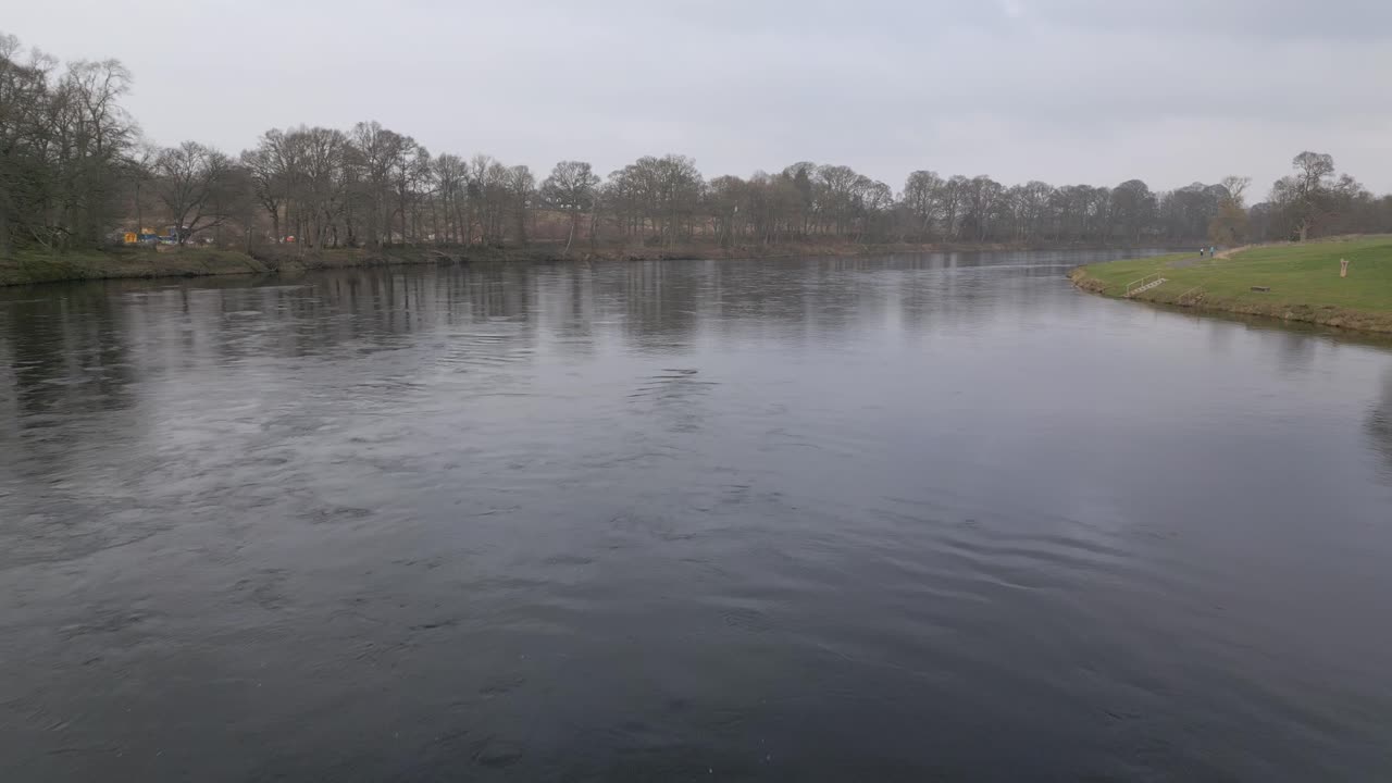Reavealing aerial shot of Destiny Bridge and River Tay in Perth, Scotland. Drone flying backwards ascending