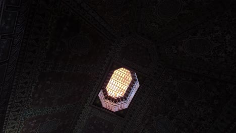 light through beautiful decorated morocco ceiling roof, dark to light transition