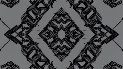 abstract geometric kaleidoscope patterns in black and grey