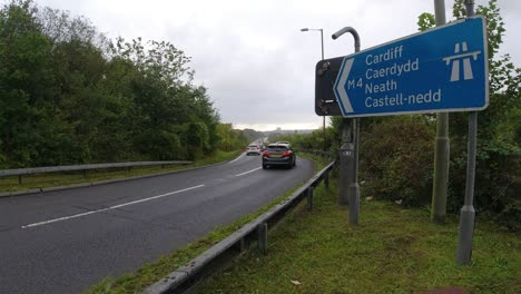 m motorway freeway junction sign with cars passing