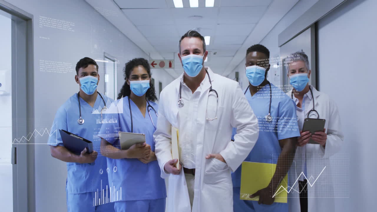 healthcare team standing in hospital corridor showing floating medical graphs, stethoscope icons