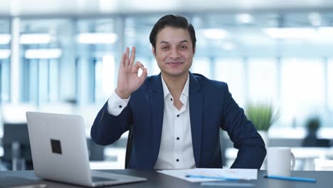 Happy-Indian-businessman-showing-okay-sign