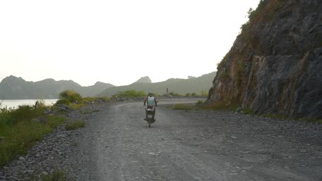 motorbike driving along vietnamese dirt road