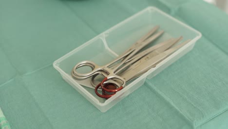 pan right medical tools on a hospital table slow motion