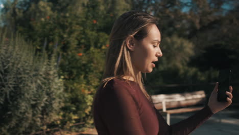 young woman using smartphone outdoors.