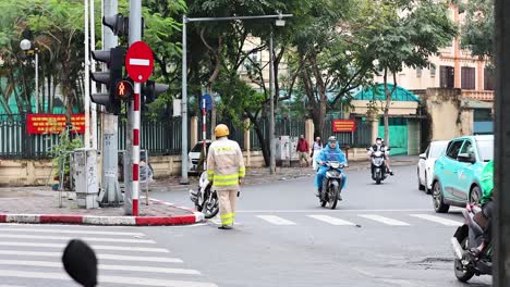 traffic officer directing vehicles at busy intersection