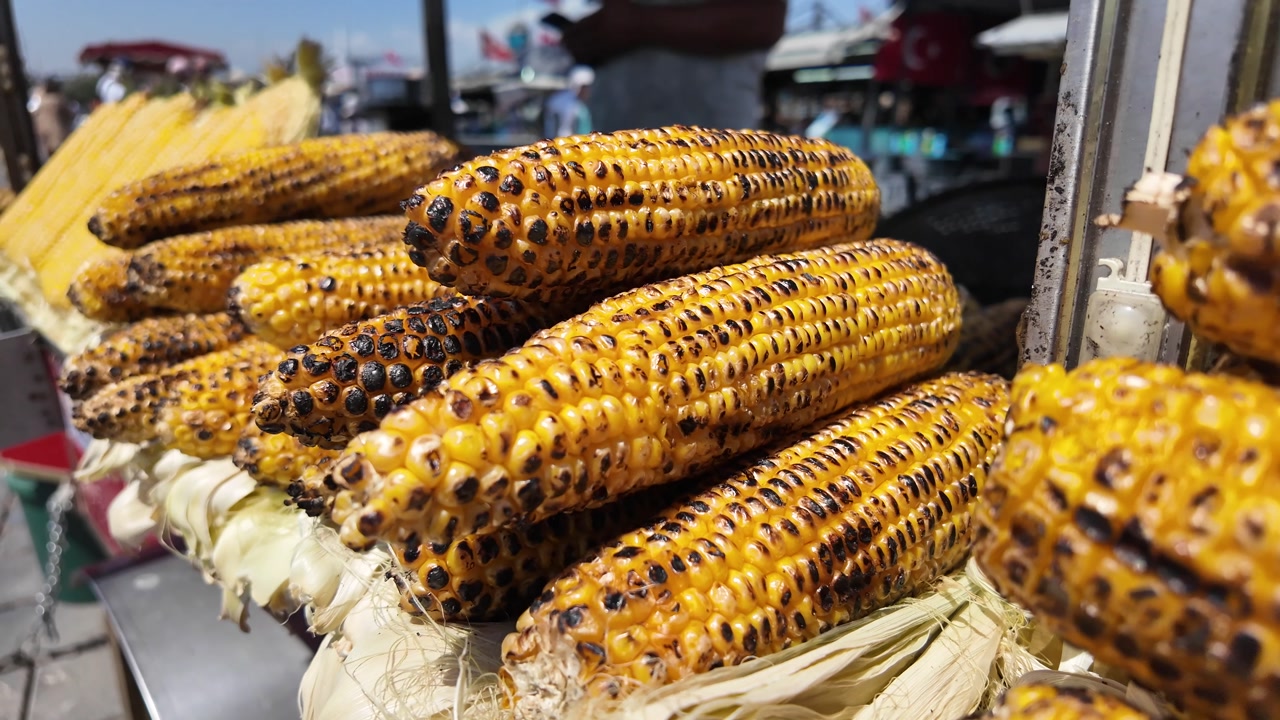 Delicious Grilled Corn Cobs on Display at a Street Food Stall