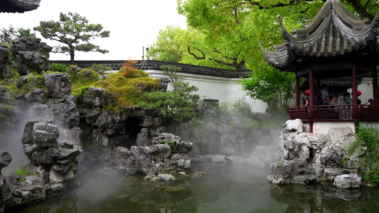 Traditional Chinese Garden with Misty Pond and Pavilion