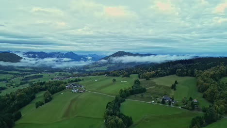 picturesque countryside landscape with austria alps in the background in central europe