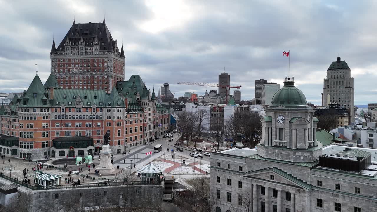 The grandeur of Quebec City's historic Chateau Frontenac in winter, set against a dramatic cloudy sky. This iconic landmark offers a picturesque scene for travel and tourism promotions, Canada