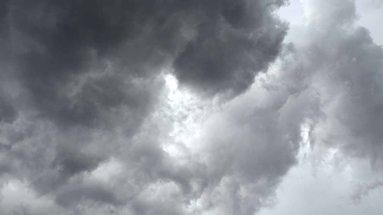 Low angle view of grey clouds moving on the sky