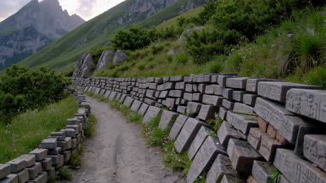 mountain path with stone wall