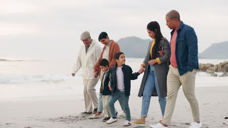 Family,-walk-on-beach-sand-and-holding-hands