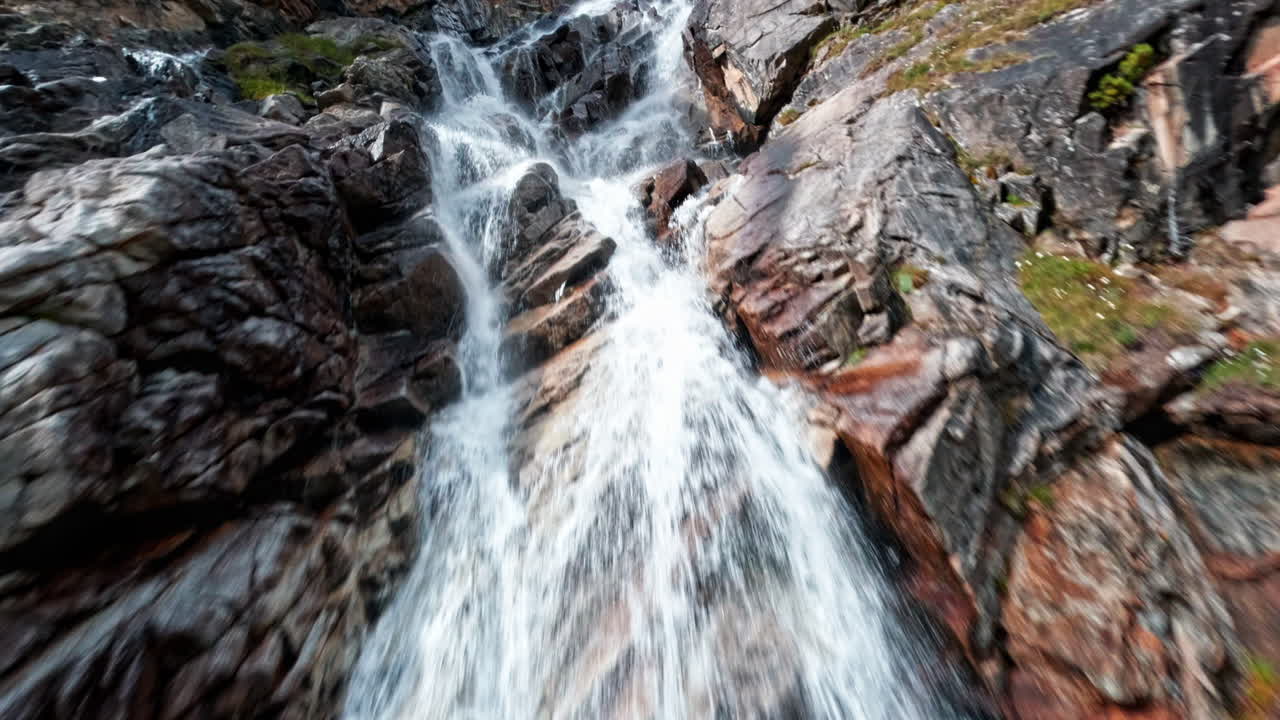 Majestic waterfall cascading near Morteratsch Glacier, peaceful nature scene