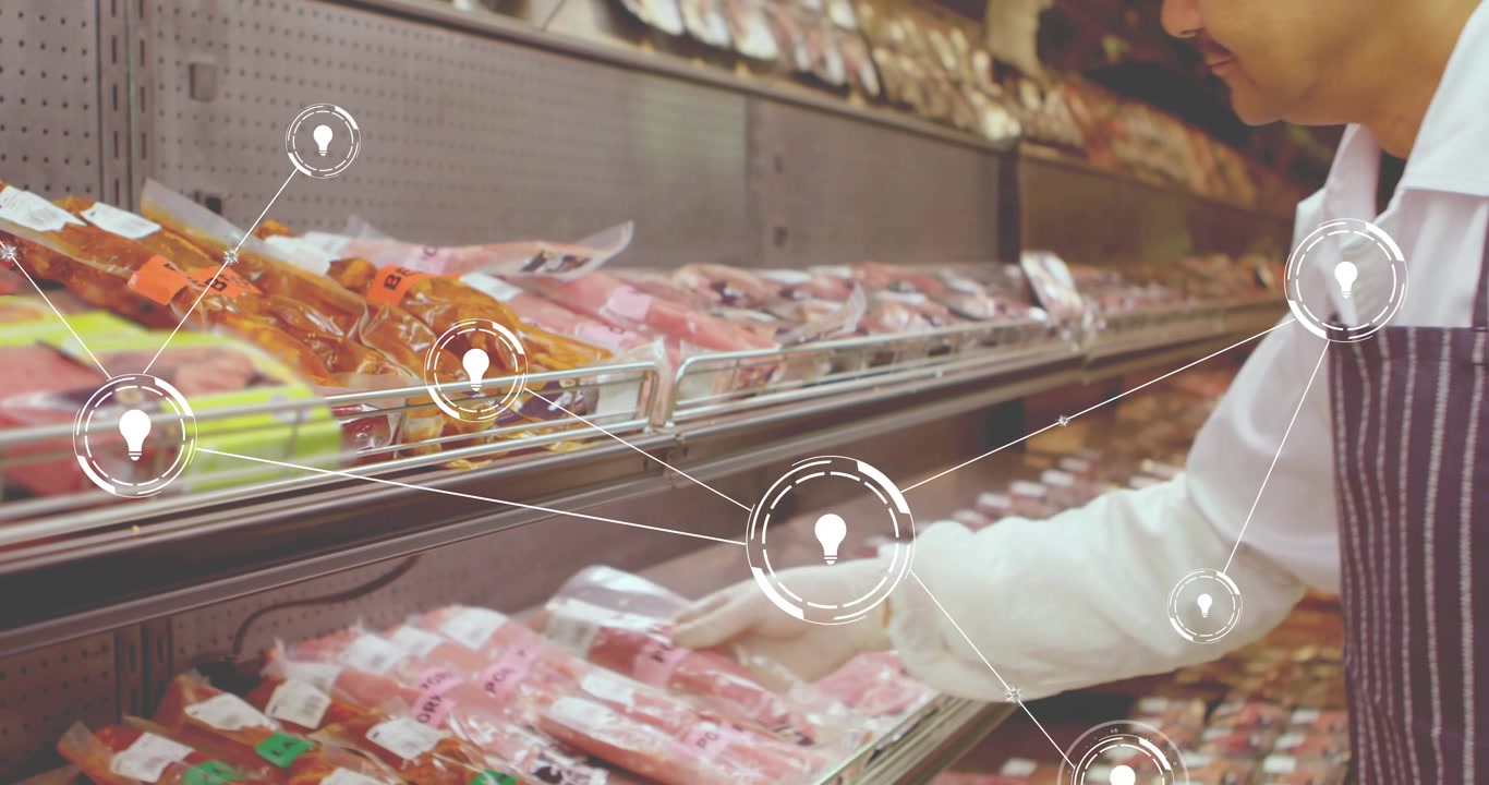Grocery employee responding to animated nodes, reaching into fridge shelf and organizing meat packs