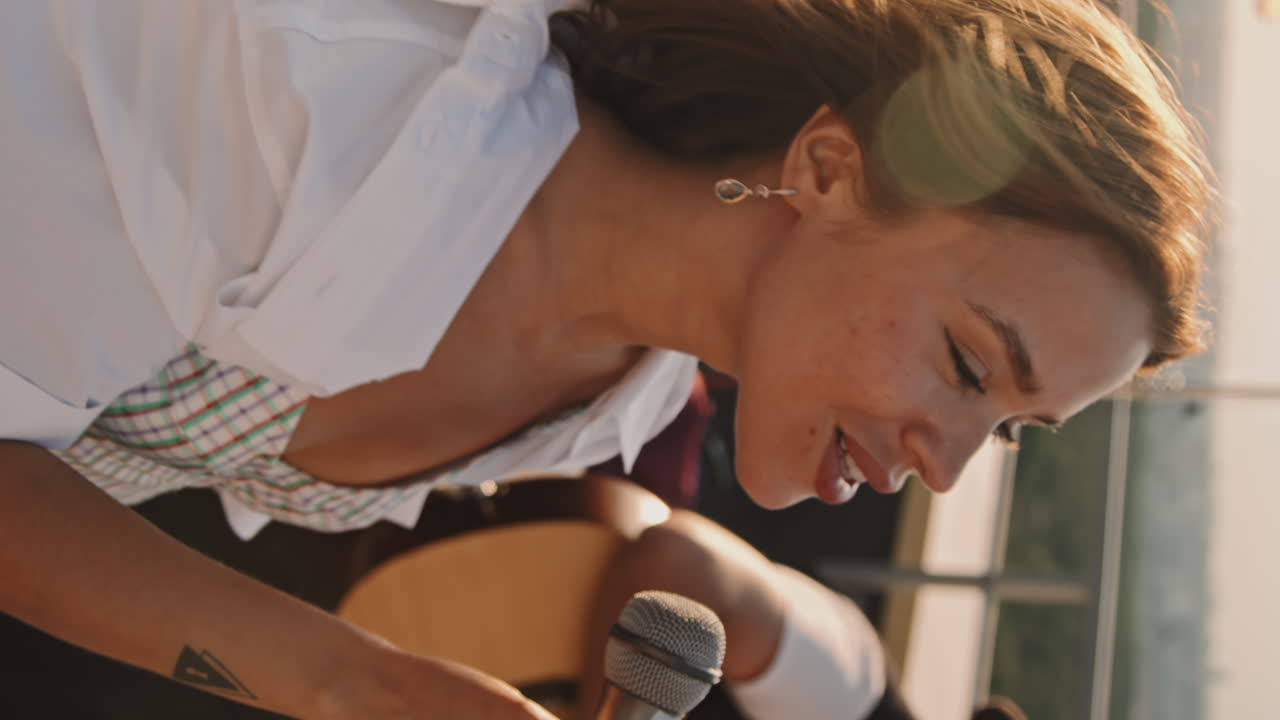 Vertical Shot of Woman Performing Song Outside