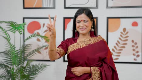 Victory-sign-shown-by-Indian-woman