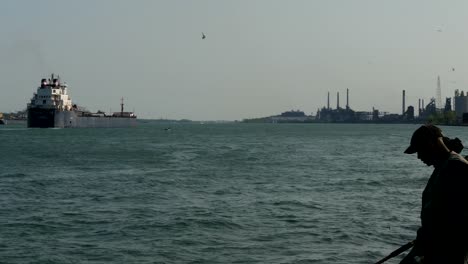 people fishing on detroit river