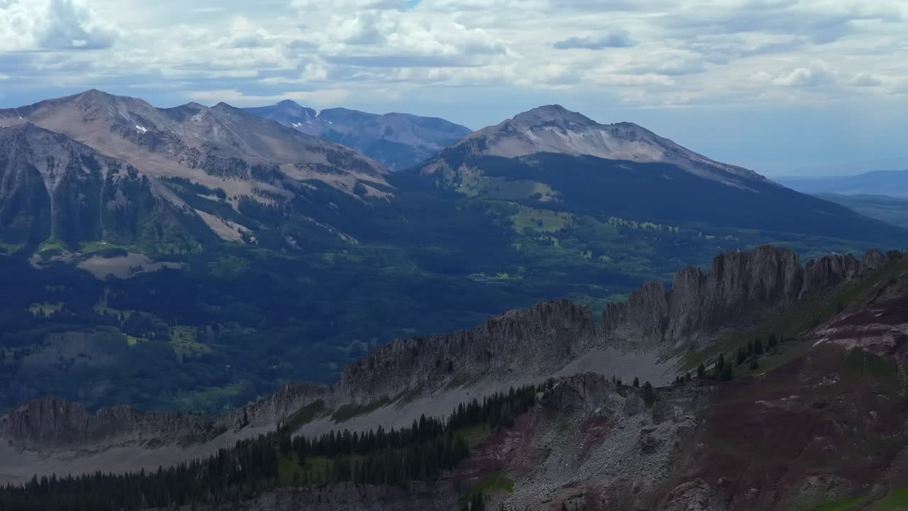 Marcellina Mountain Kebler Pass Crested Butte Colorado aerial drone spring summer morning afternoon daytime Ruby Peak Rocky Mountains Gunnison National Forest cloudy parallax circle right motion