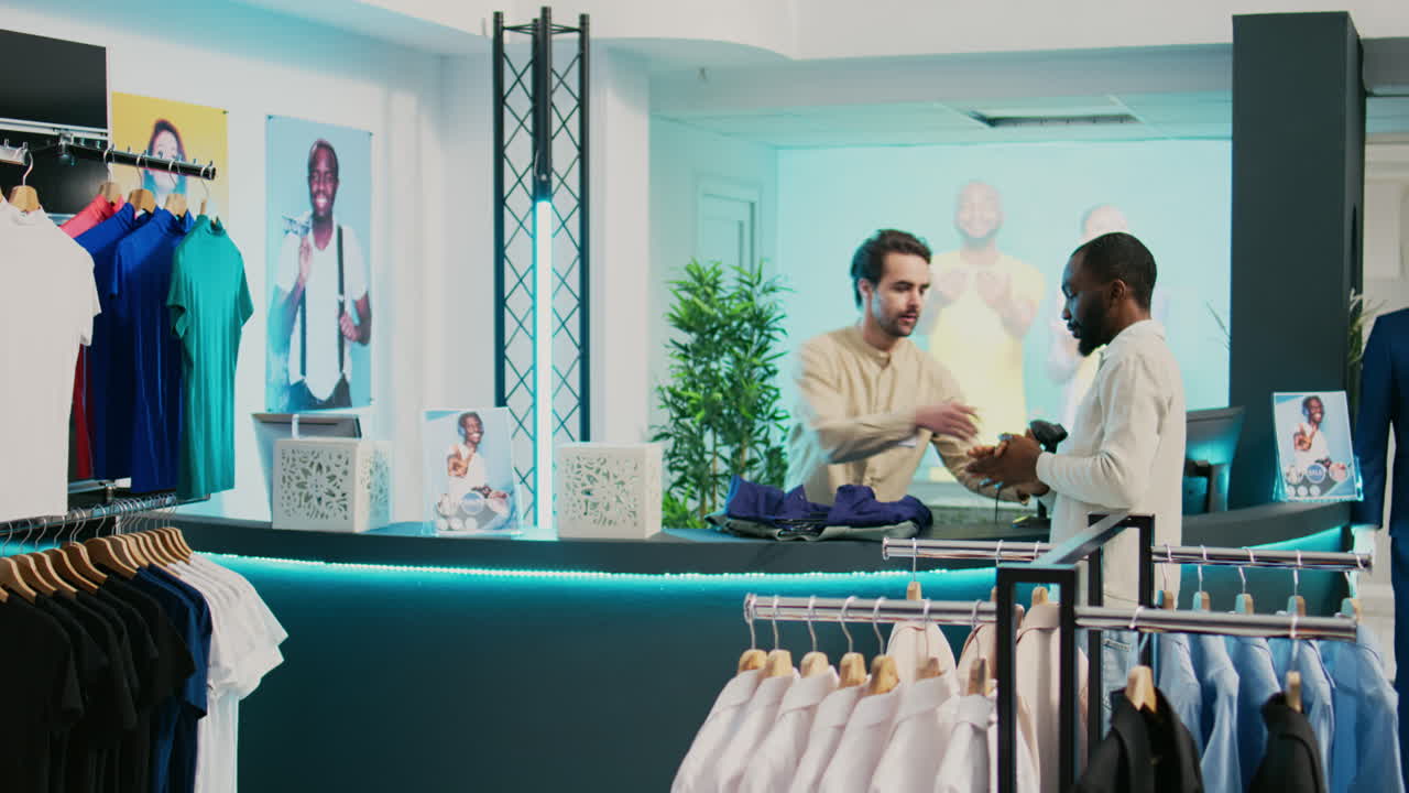 Clothing store interior with mannequins, shirts, and shoppers