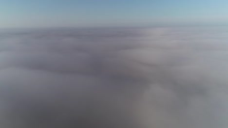 flight above clouds in morning golden hour