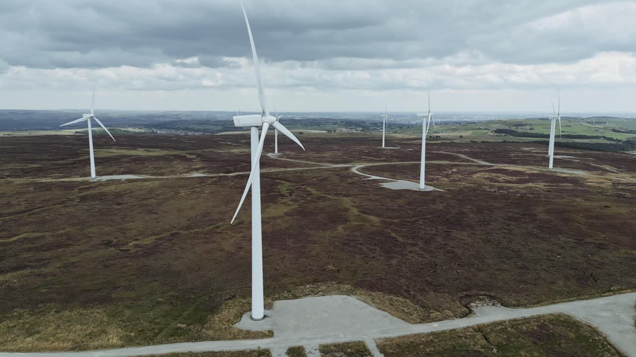 Drone aerial view of a wind farm and wind turbines turning in the wind-4
