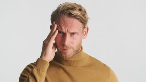 worried man feeling bad because of headache