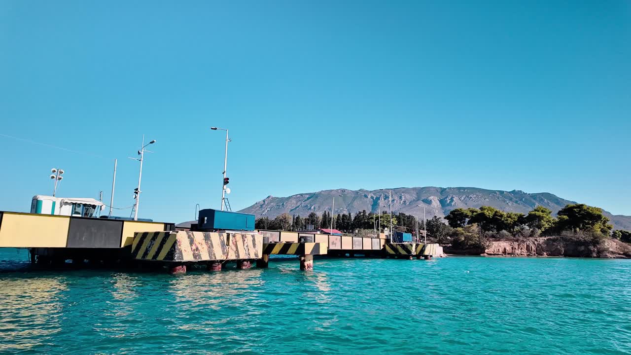 Motorcyclist crossing Corinth canal submersible road bridge