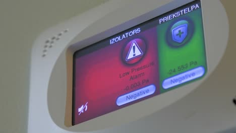 view of hospital room pressure monitoring device mounted on the wall, healthcare equipment, closeup shot