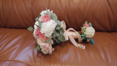 wedding rings and bouquet