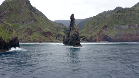 rock formation on coast on cloudy day