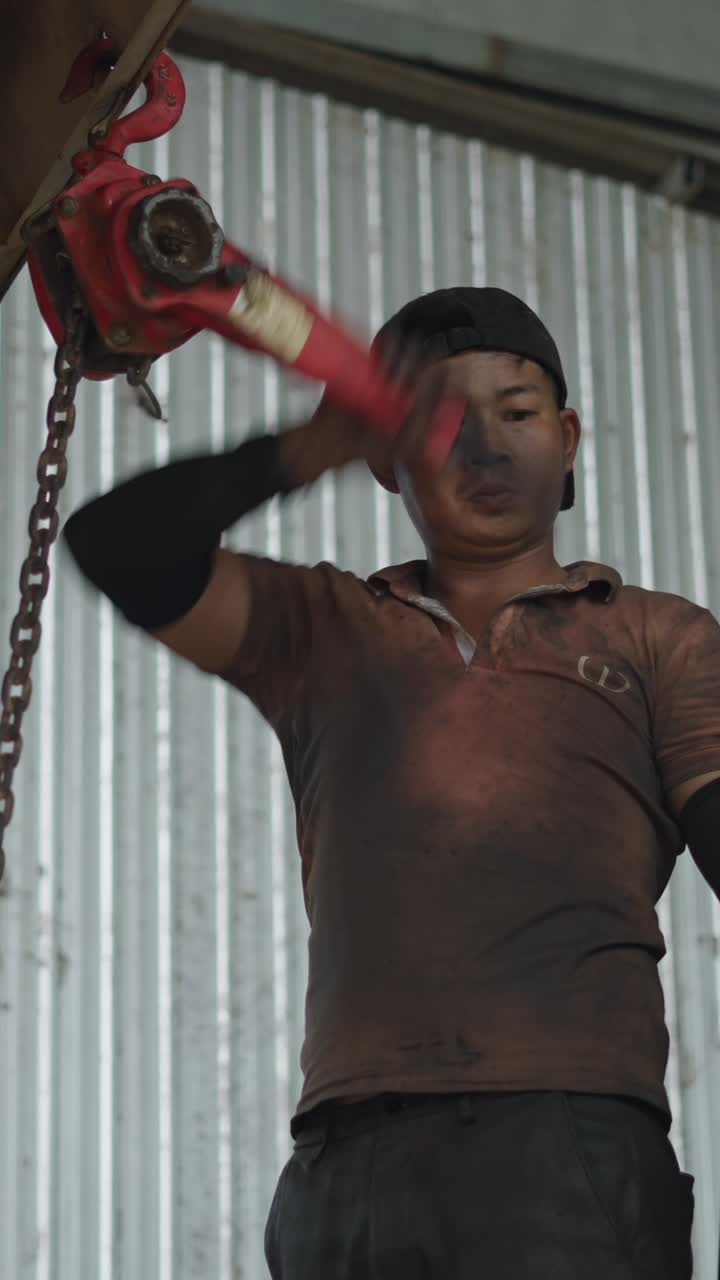 Man Working with Hoist