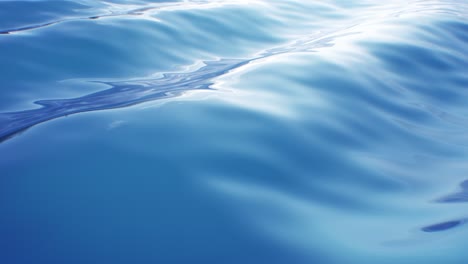 beautiful waves on blue abstract water surface seamless. looped 3d animation