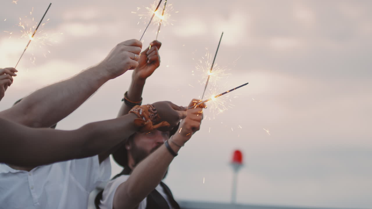 People with Sparklers Partying Outdoors