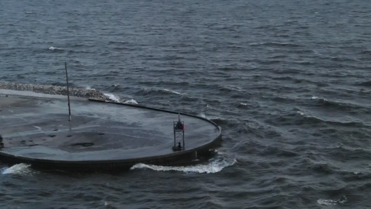 Waves Hit On Concrete Jetty During Stormy Day. Aerial Orbit