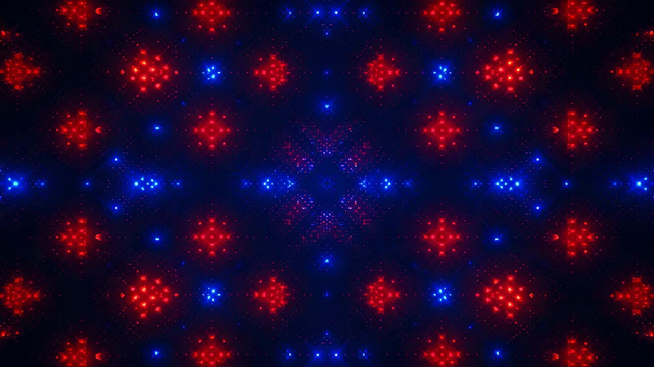 Starting playback, expanding red diamond and blue cross pattern filling black field, shimmering