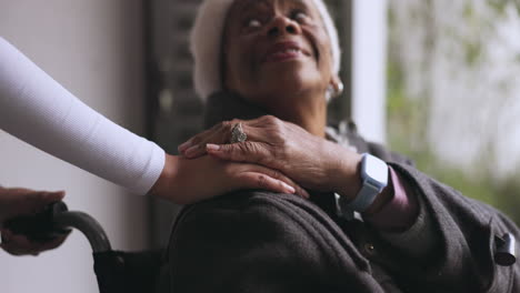 Hands,-nurse-and-old-woman-in-wheelchair