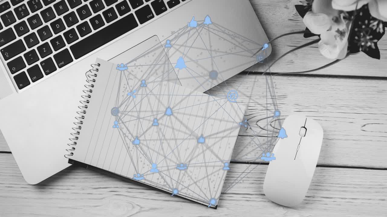 Starting desk view capturing network growing with icons and links over notebook, laptop and mouse