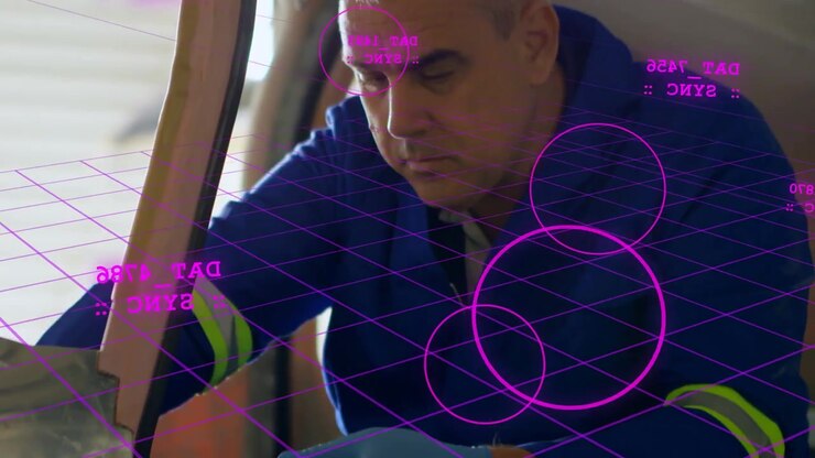 Male tech inserting driver into hatch activating magenta holo grid aligning screws, servicing panel