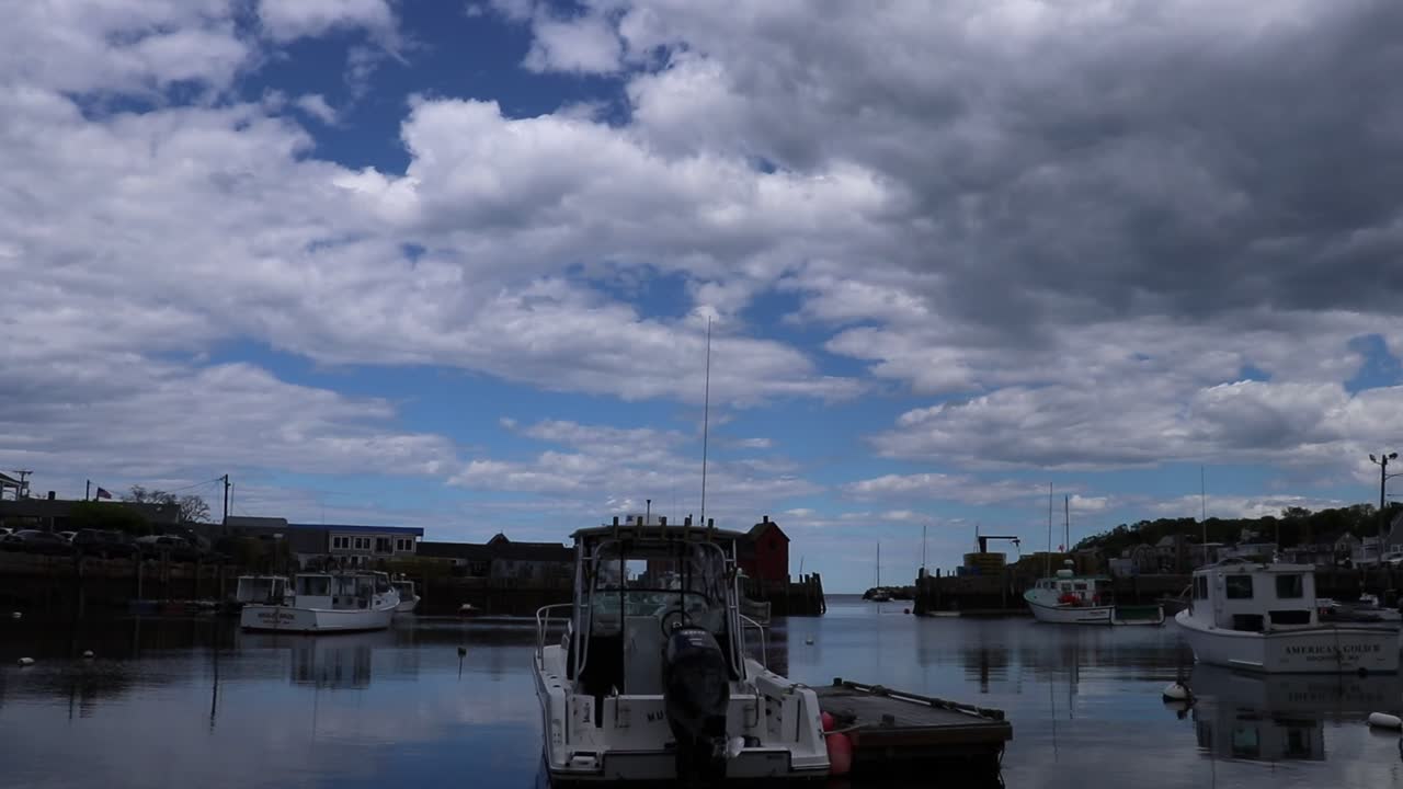 Several Motor Boats Floating in Rockport Massachusetts, Marvelous Sky Background with clear reflection from the water