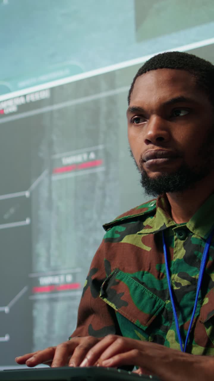 Vertical Video Military professionals in a mission control center employs modern technology