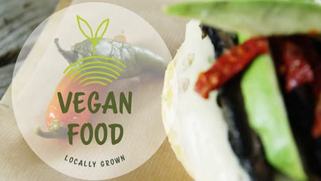 Vegan-food-text-banner-against-close-up-of-a-food-item