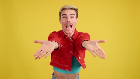 man in red jacket making heart gesture
