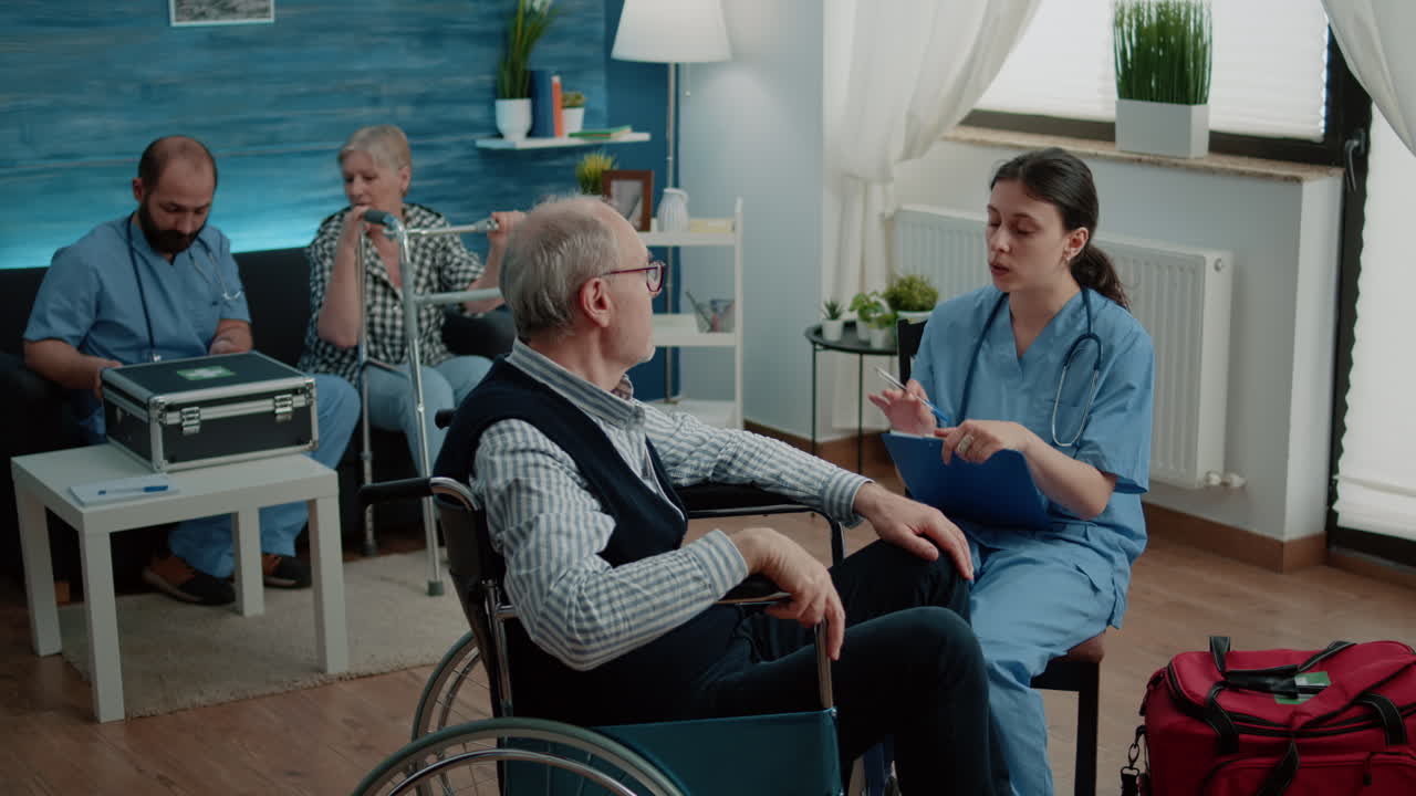 Elder patient talking to nurse for healthcare consultation