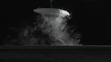 slow motion dry ice fog-vapor floating on surface of water and bubbling in water. for use with visual effects and-or texturing and design.