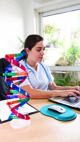 female doctor works with computer in the office, and dna helix on desk.