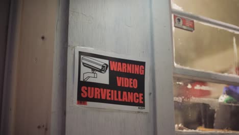 warning video surveillance sign camera zoom in dolly