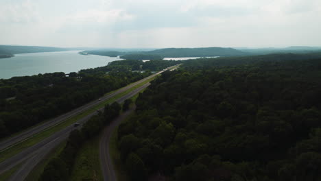 Aerial-establishing-shot-of-Spadra-park-with-road-and-cars-driving,-sideways