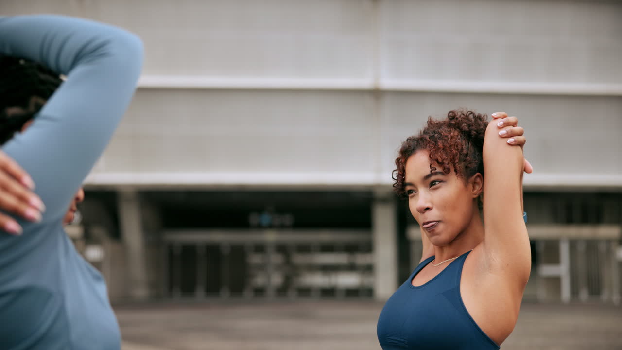 Two Women Stretching Outdoors