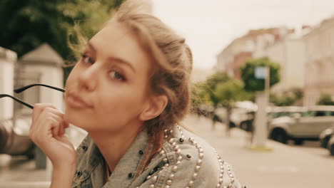 stylish woman in a studded denim jacket